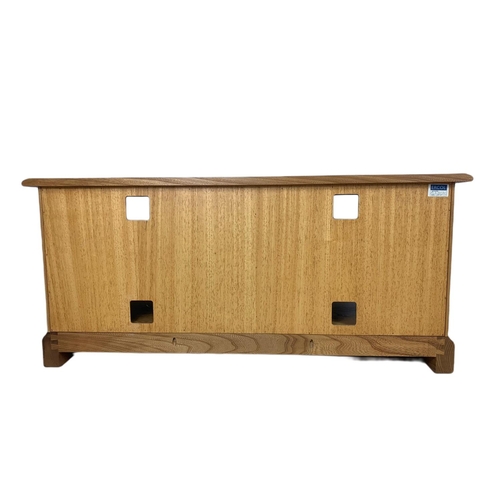 1069 - Blonde Ercol TV/side unit. 119/51.5/49.5cm