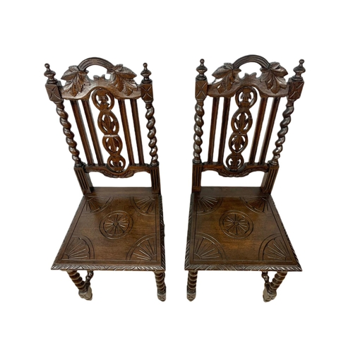 1071 - Pair of late 19th century carved oak side chairs, in the Jacobean style.