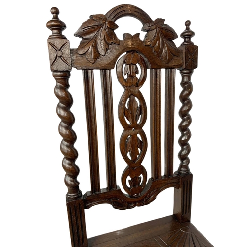 1071 - Pair of late 19th century carved oak side chairs, in the Jacobean style.