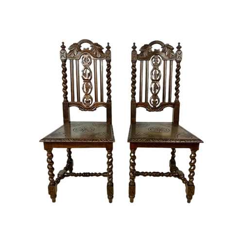 1071 - Pair of late 19th century carved oak side chairs, in the Jacobean style.