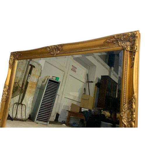 1052 - Large ornate gilt framed mirror, 104/74cm