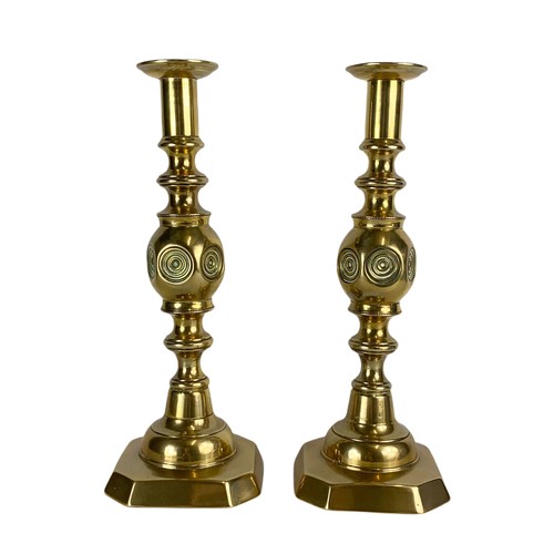 735 - Pair of Victorian brass candlesticks with 2 other brass ornaments.