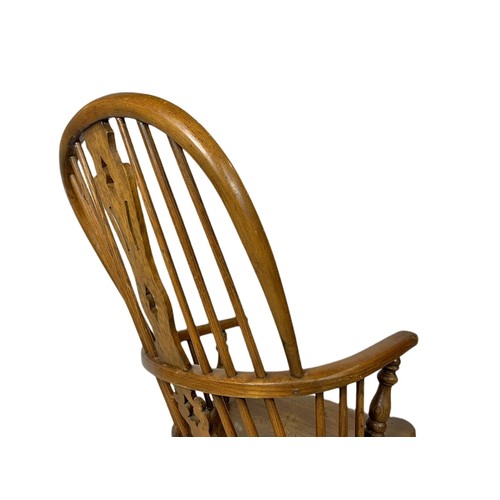 911 - Mid 19th century Windsor elm and beech rocking chair.