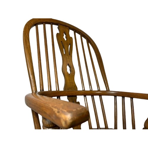 911 - Mid 19th century Windsor elm and beech rocking chair.