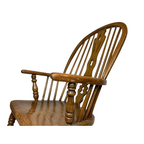 911 - Mid 19th century Windsor elm and beech rocking chair.