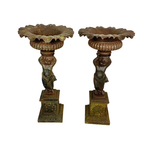 710 - Pair of of late 19th century cast iron garden urns. 63cm