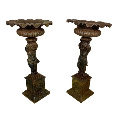 710 - Pair of of late 19th century cast iron garden urns. 63cm