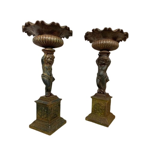 710 - Pair of of late 19th century cast iron garden urns. 63cm