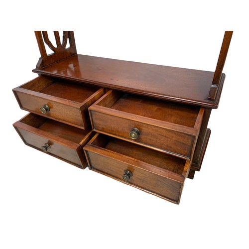 1011 - Mahogany 4 drawer shelving unit. 52/17/111cm