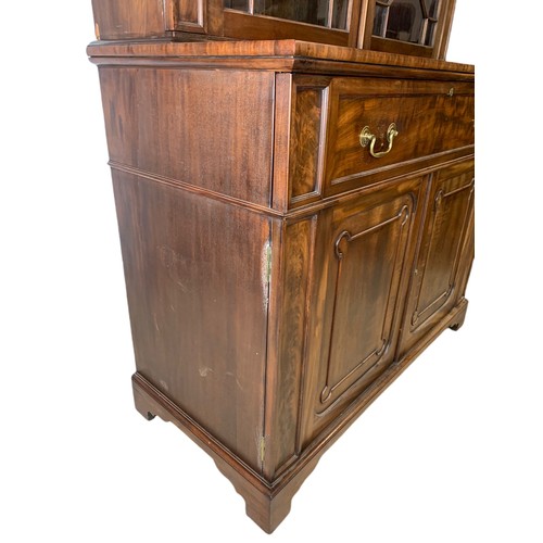 918 - Large Victorian secretaire bookcase in the Georgian style. With swan neck open fret 126/57/231cm