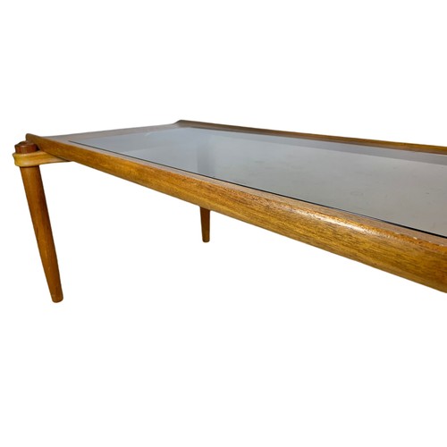 964 - Long teak mid century coffee table with smoked glass. 122/56/41.5cm