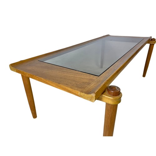 964 - Long teak mid century coffee table with smoked glass. 122/56/41.5cm