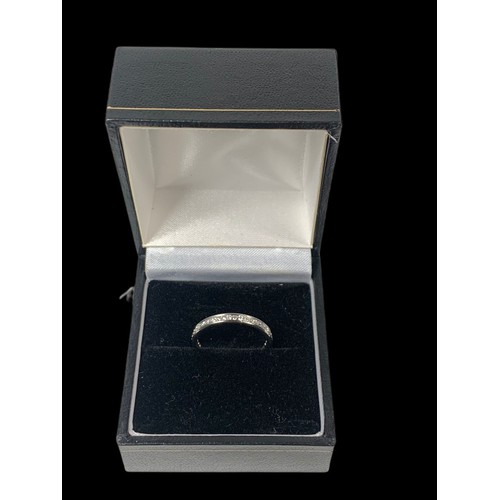 801G - 18ct white gold diamond ring. Consisting of 27 modern brilliant cut diamonds. All stones in a channe... 