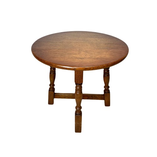 1074 - Reproduction oak cricket table, joint stool and an oak occasional table 61/61/71cm