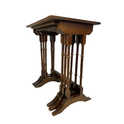 1092 - Georgian style leather top nest of mahogany tables.