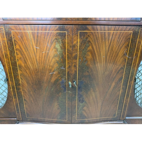 1107 - Large Georgian style inlaid mahogany serpentine sideboard. 149/40/142cm