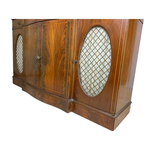 1107 - Large Georgian style inlaid mahogany serpentine sideboard. 149/40/142cm