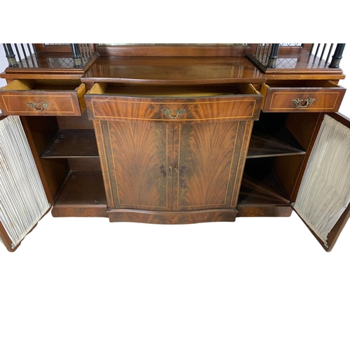 1107 - Large Georgian style inlaid mahogany serpentine sideboard. 149/40/142cm