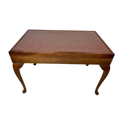 1087A - Mahogany leather top games table. 76/48/49cm