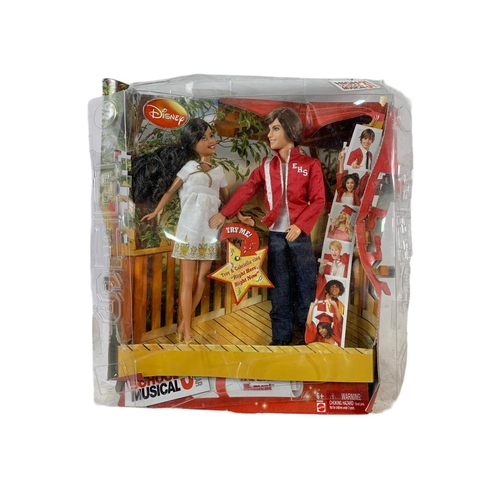 164 - High School Musical dolls etc in boxes. Largest box 46x28cm