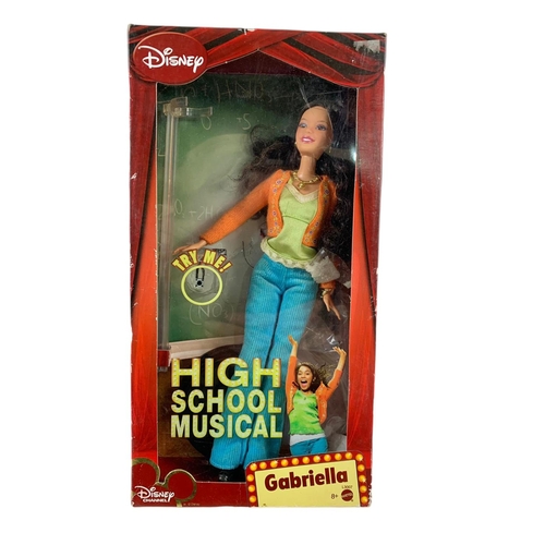 164 - High School Musical dolls etc in boxes. Largest box 46x28cm