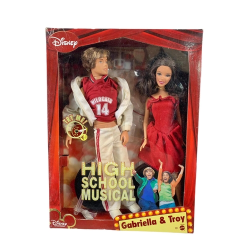 164 - High School Musical dolls etc in boxes. Largest box 46x28cm