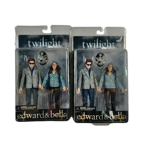 165 - 6 Twilight action figures in boxes. “Jacob x2, Edward & Bella x2, Jasper, Edward” boxes measure 17x2... 