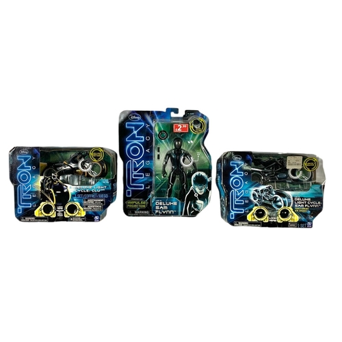 170 - 3 Disney Tron Legacy action figures in boxes. “Deluxe Light Cycle Sam Flynn, Deluxe Light Cycle Clu,... 