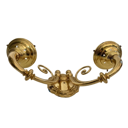 194 - Pair of heavy brass wall lights. 43/28cm