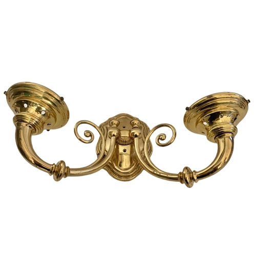 194 - Pair of heavy brass wall lights. 43/28cm