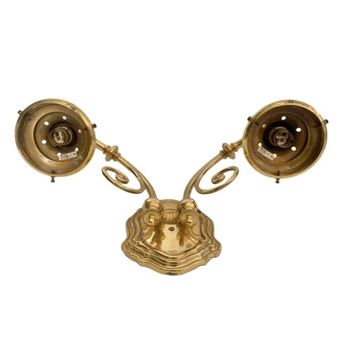 194 - Pair of heavy brass wall lights. 43/28cm