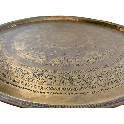 196 - Large early 20th century brass Burmese table top/wall plaque. 63cm