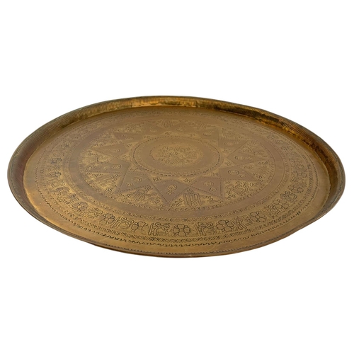 196 - Large early 20th century brass Burmese table top/wall plaque. 63cm