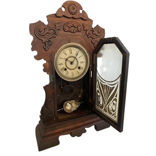 209 - Victorian gingerbread clock. With key and pendulum. 36/13/59cm