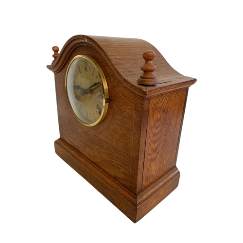 210 - Edwardian inlaid oak mantle clock. 30/13.5/29.5cm