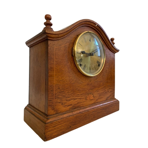 210 - Edwardian inlaid oak mantle clock. 30/13.5/29.5cm