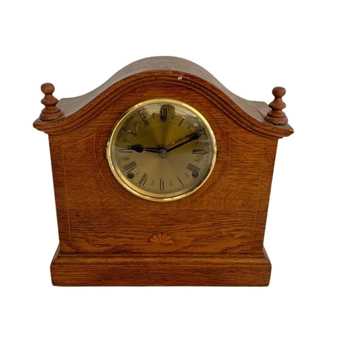 210 - Edwardian inlaid oak mantle clock. 30/13.5/29.5cm