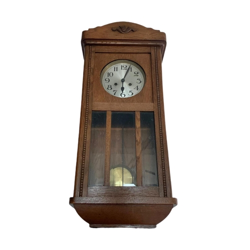 227 - 1930’s oak case wall clock. 34/83cm