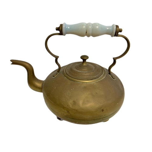 229 - Victorian brass kettle and a bellows. 61.5cm