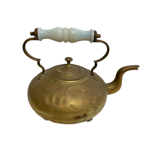 229 - Victorian brass kettle and a bellows. 61.5cm