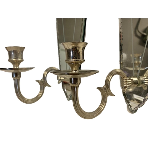 240 - Pair of mirrored wall sconces. Height 46cm