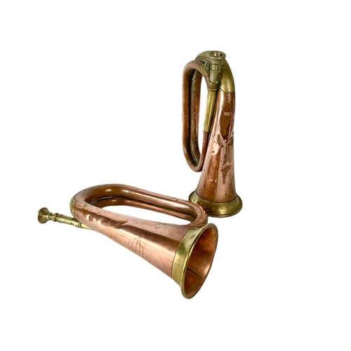 27 - Pair of early 20th century brass and copper bugles. 29cm