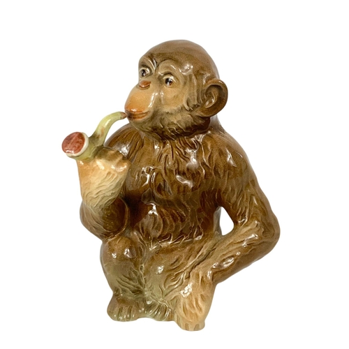 399 - Beswick pottery monkey with pipe. 12.5cm