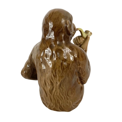 399 - Beswick pottery monkey with pipe. 12.5cm