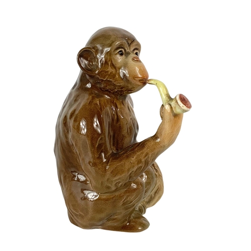 399 - Beswick pottery monkey with pipe. 12.5cm