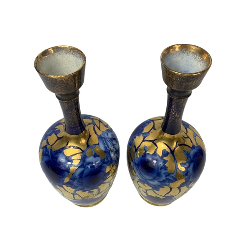 402 - Pair of late 19th century painted vases. 25cm