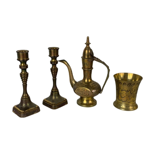 42 - Brass mantle clock, pair of vintage candle sticks and 4 piece of brassware. Clock 15x20cm