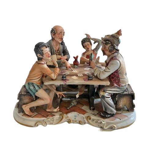 436 - Large Capodimonti pottery figure. Cheating card game. 37/28/26cm