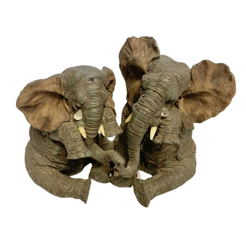 442 - 2 resin elephant figures. Largest 28cm