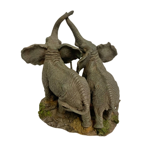 442 - 2 resin elephant figures. Largest 28cm